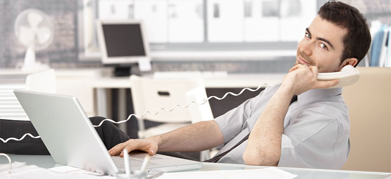 Male stock broker talking on phone
