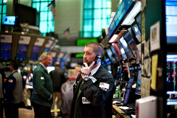 Man on phone at stock market